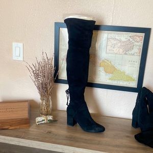 Thigh- high black heeled boots